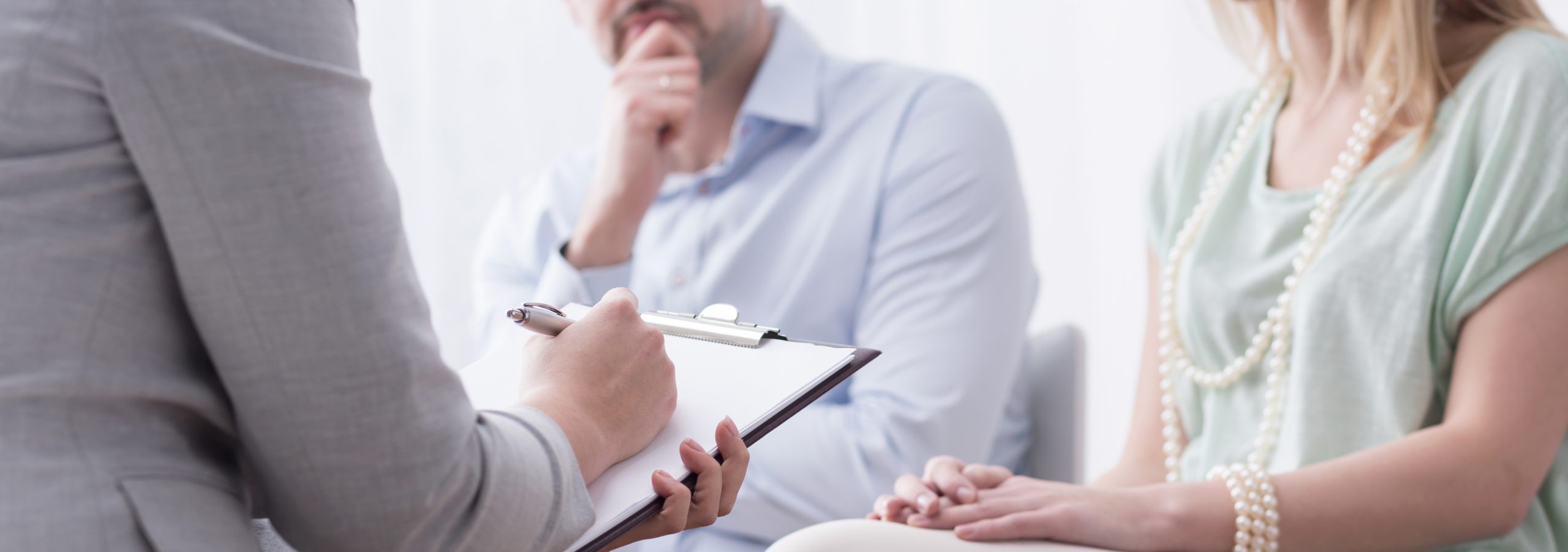 Panorama of psychologist helping married couple with problem